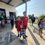 Waco area students with new backpacks from The Carlson Law Firm.